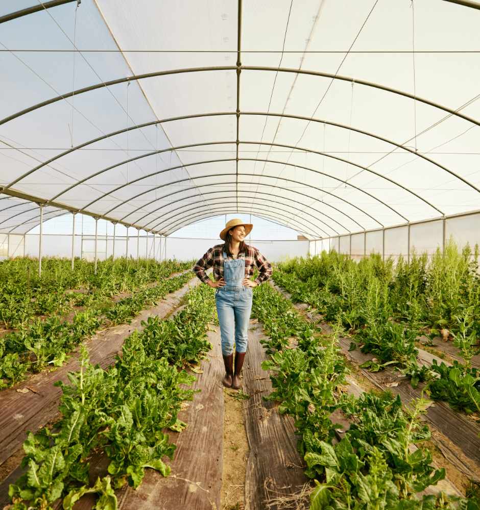 Farmer, greenhouse and happy agriculture woman in eco friendly b